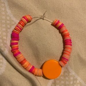 Orange mixed bracelet.